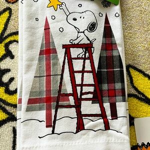 Set of two Peanuts Snoopy Christmas Kitchen Towels. Both are the same pattern.